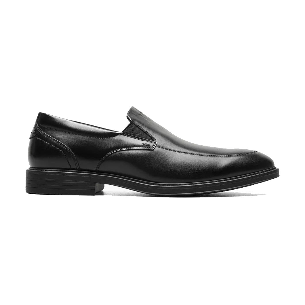 A single Nunn Bush Centro Flex Moc Toe Venetian Black Smooth men&#39;s dress shoe with a low heel and elastic side panels, featuring a Softgel heel pod, shown in profile view on a plain white background.