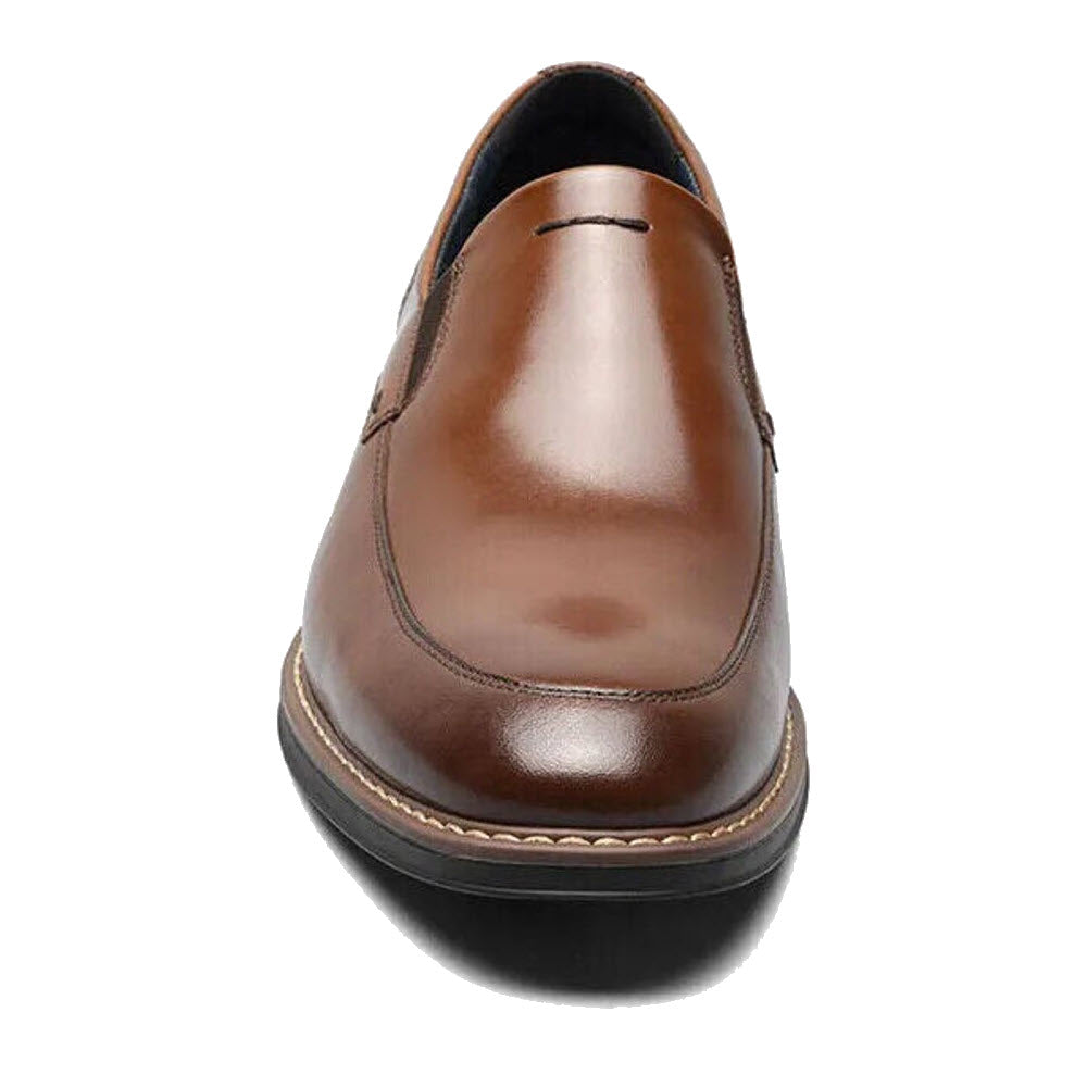 Top view of a single brown leather Nunn Bush Centro Flec Moc Toe Venetian Cognac dress shoe with black soles and visible stitching.