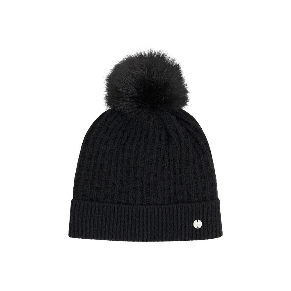 A Kooringal black knitted Jess beanie with a ribbed design featuring a logo on the cuff and a large faux fur pom-pom on top, isolated on a white background.