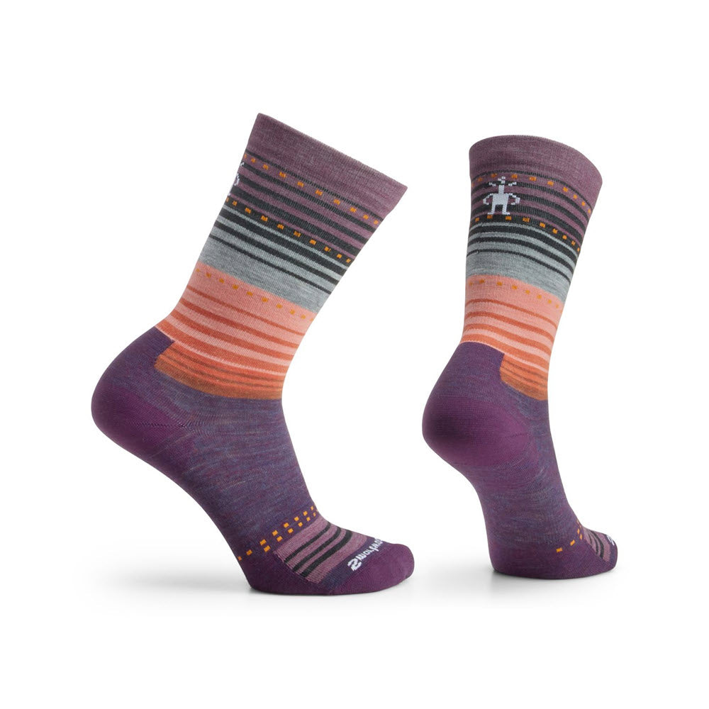 A pair of Smartwool Stitch Stripe Crew socks in shades of purple, orange, and gray, displayed against a white background.