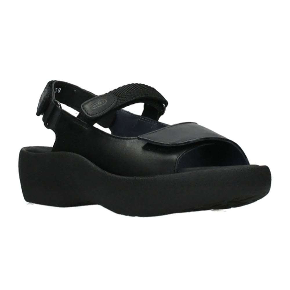 Wolky black platform walking sandal with a chunky sole and a velcro strap closure for an adjustable fit, viewed from the side.