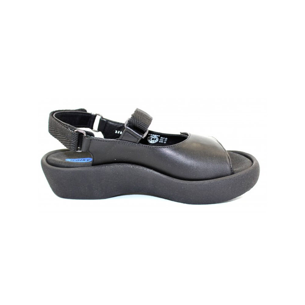 Wolky black platform walking sandal with adjustable fit straps on a white background.
