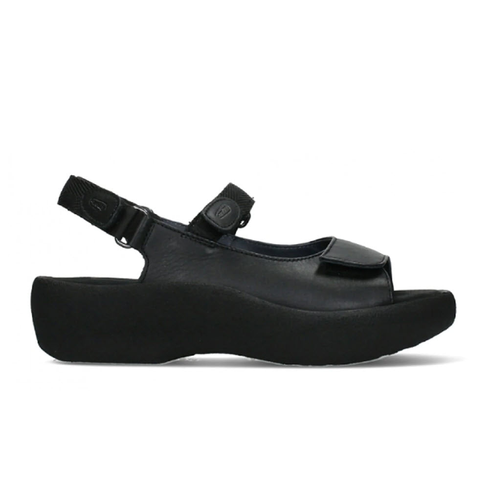 Wolky Jewel black smooth sandal with a thick sole and adjustable fit, isolated on a white background.