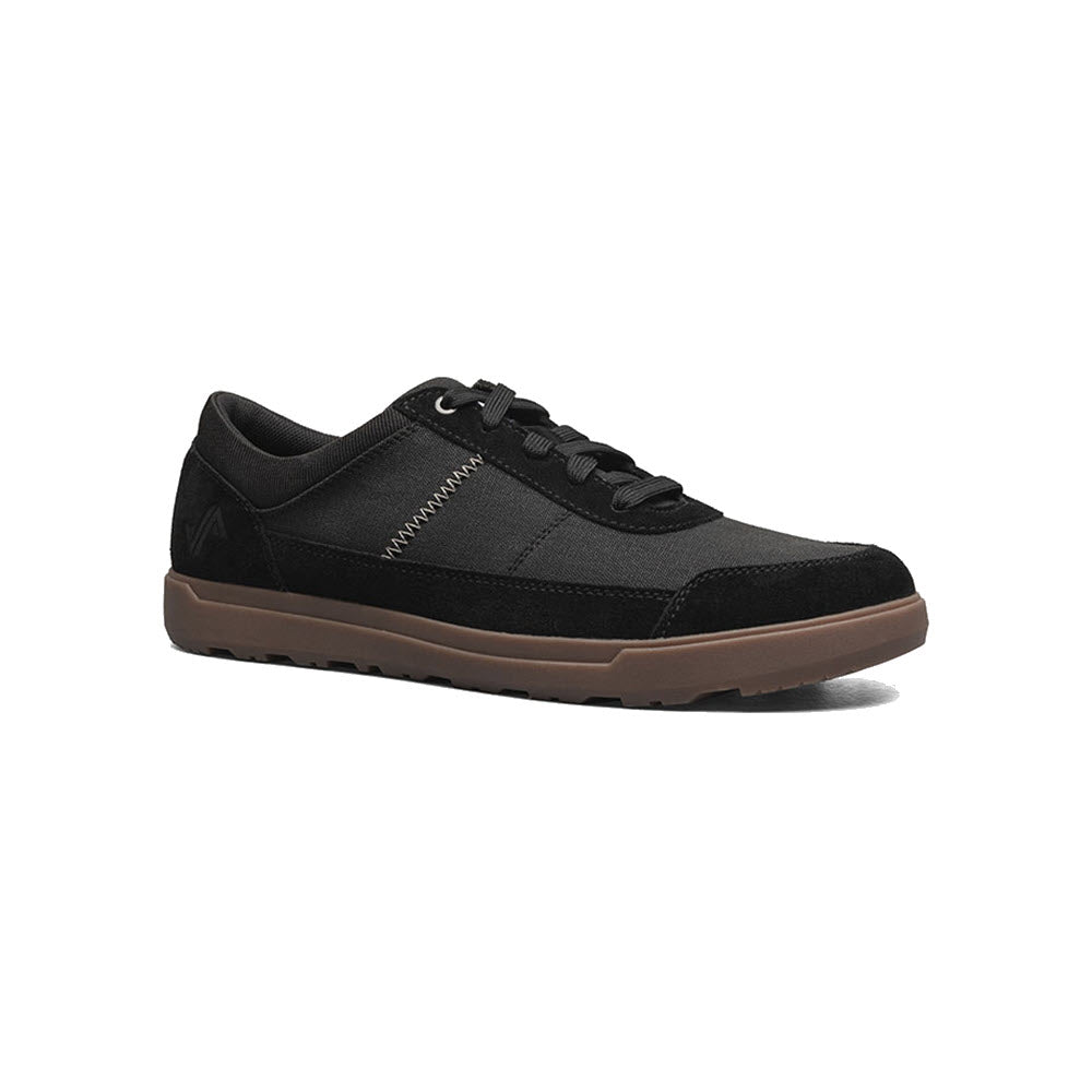 A Forsake Mason Low Waxed Canvas Oxford Black - Men&#39;s sneaker with brown soles displayed against a white background.