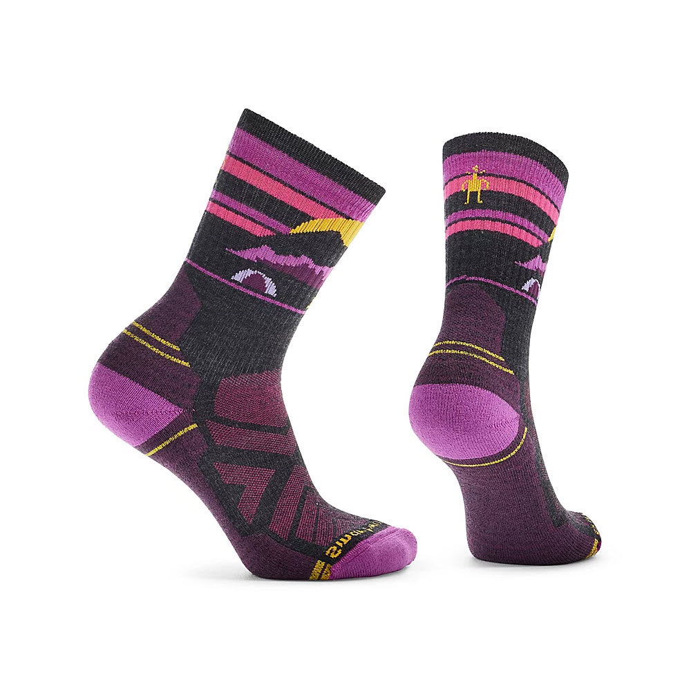 A pair of Smartwool Women’s Hike Mountain Moon Moonbeam socks in purple and black with pink accents, displayed against a white background.