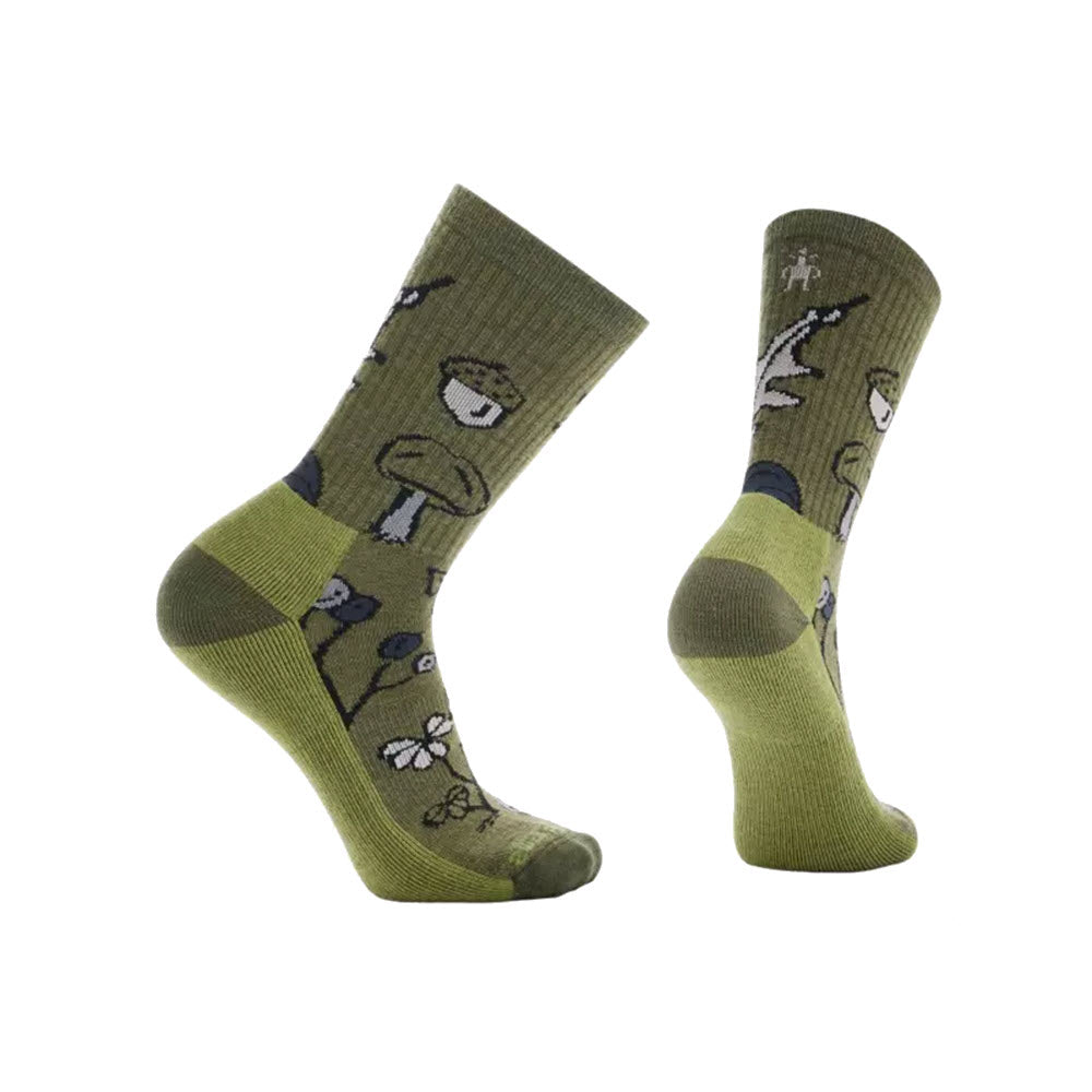 A pair of Smartwool Forest Loot Crew Socks with animal and nature-themed patterns displayed against a white background.
