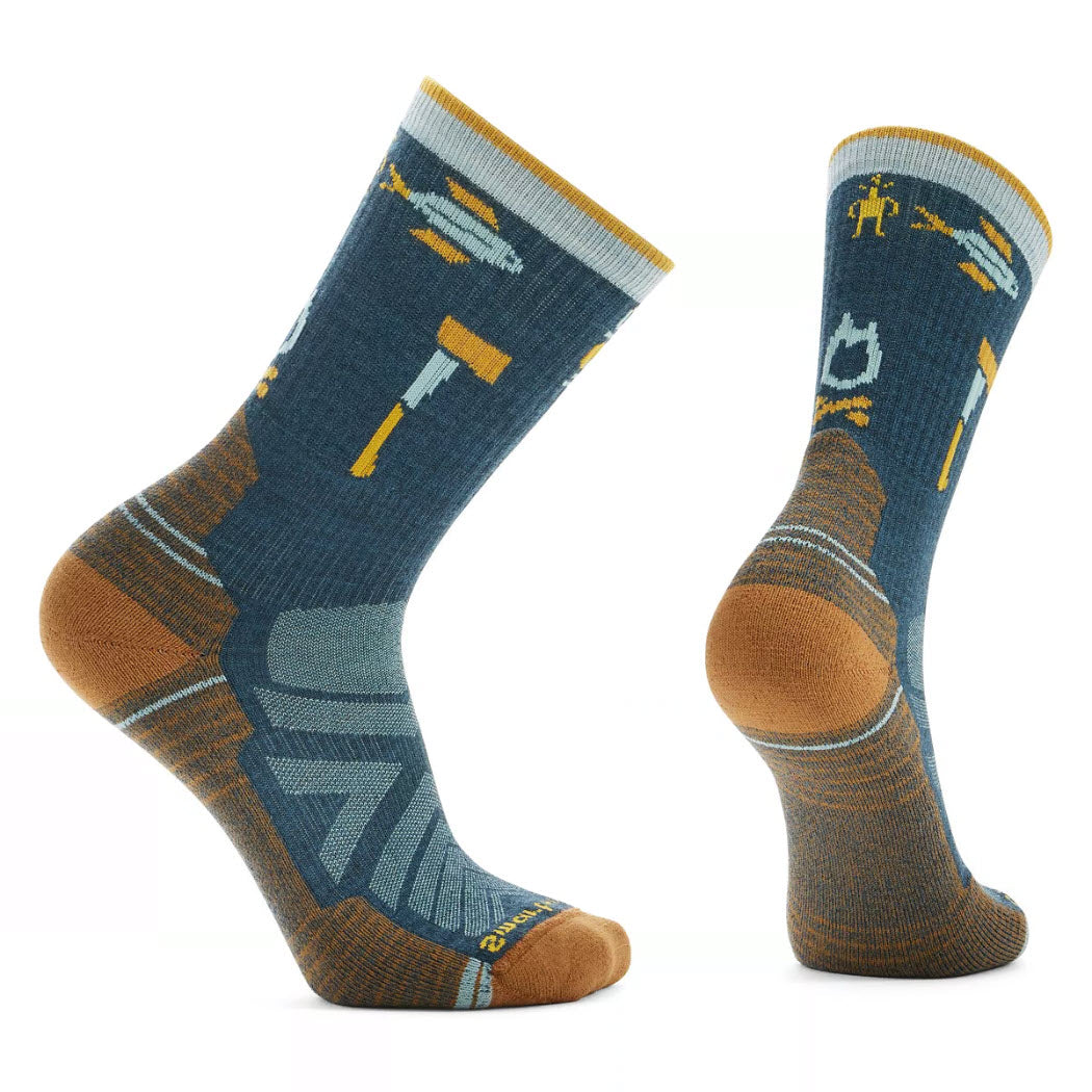 A pair of Smartwool Hike Men's Camp Gear Crew Socks Twilight Blue - Men's with tool designs displayed in front and side views on a white background.