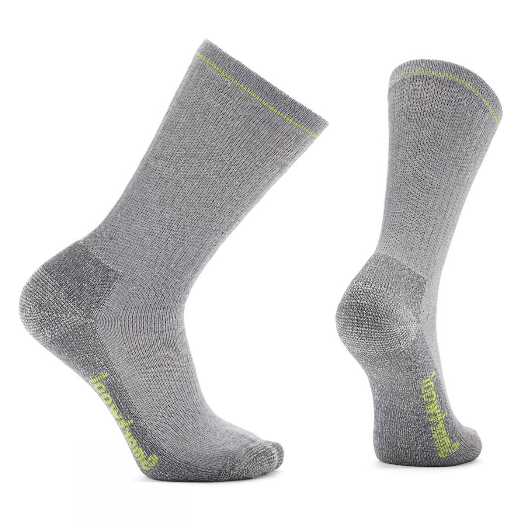 A pair of Smartwool Hike Classic Full Cushion Second Cut Crew Socks in gray, made from recycled yarn, with reinforced heel and toe areas, highlighted with a yellow logo on the side.