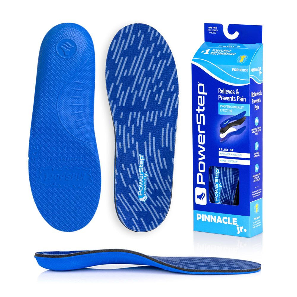 Blue Powerstep Pinnacle Junior orthotic insoles displayed with their packaging, highlighting features for foot function and arch support.