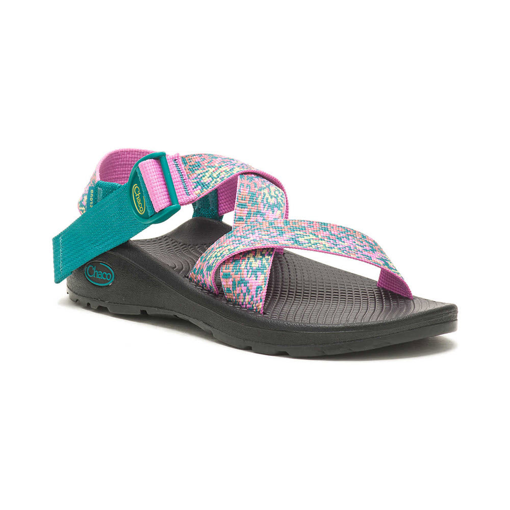 A single Chaco sandal featuring vibrant pink, purple, and turquoise straps on a LUVSEAT footbed, isolated against a white background.
