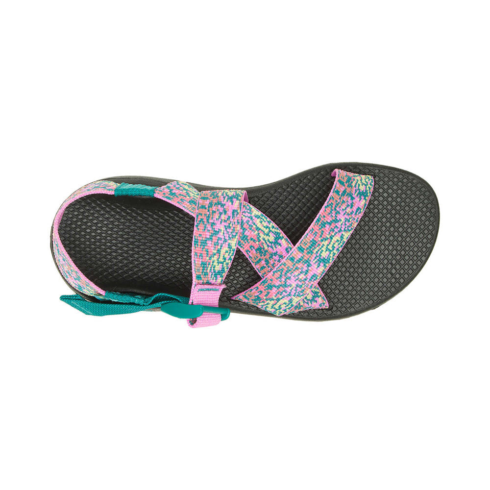Top view of a pair of CHACO MEGA Z/CLOUD SPRAY TEAL - WOMENS children&#39;s sandals with Velcro straps, featuring pink and teal accents and a ChacoGrip rubber outsole on a white background.