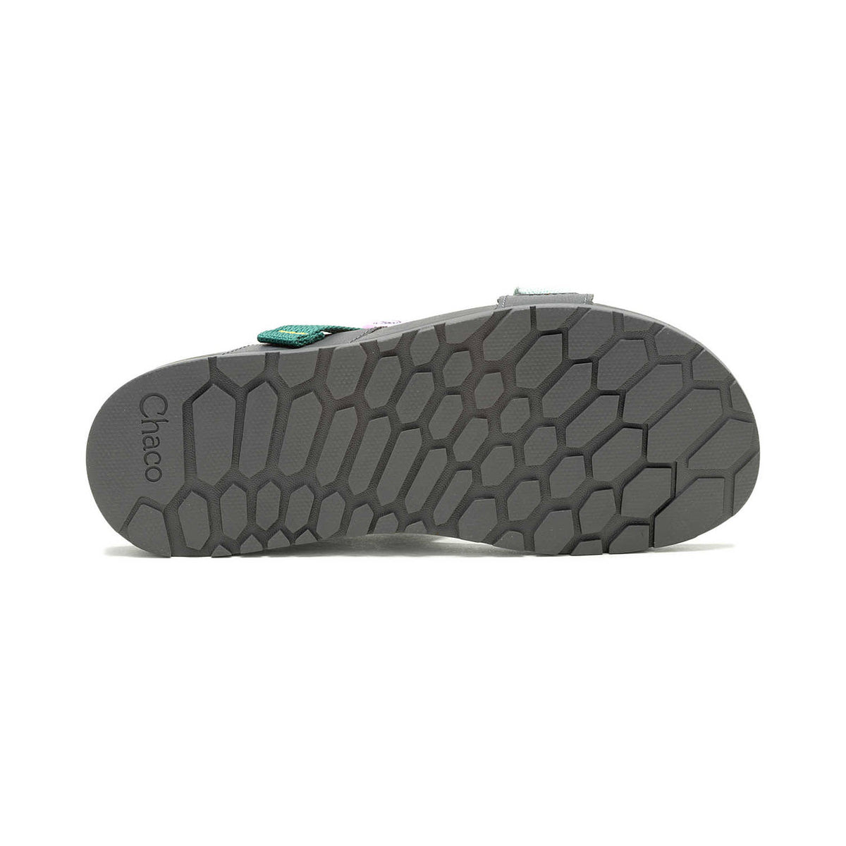 Bottom view of a Chaco Lowdown Sandal Surf Spray - Womens sport sandal showcasing its hexagon-patterned sole and a small green logo on the heel strap.