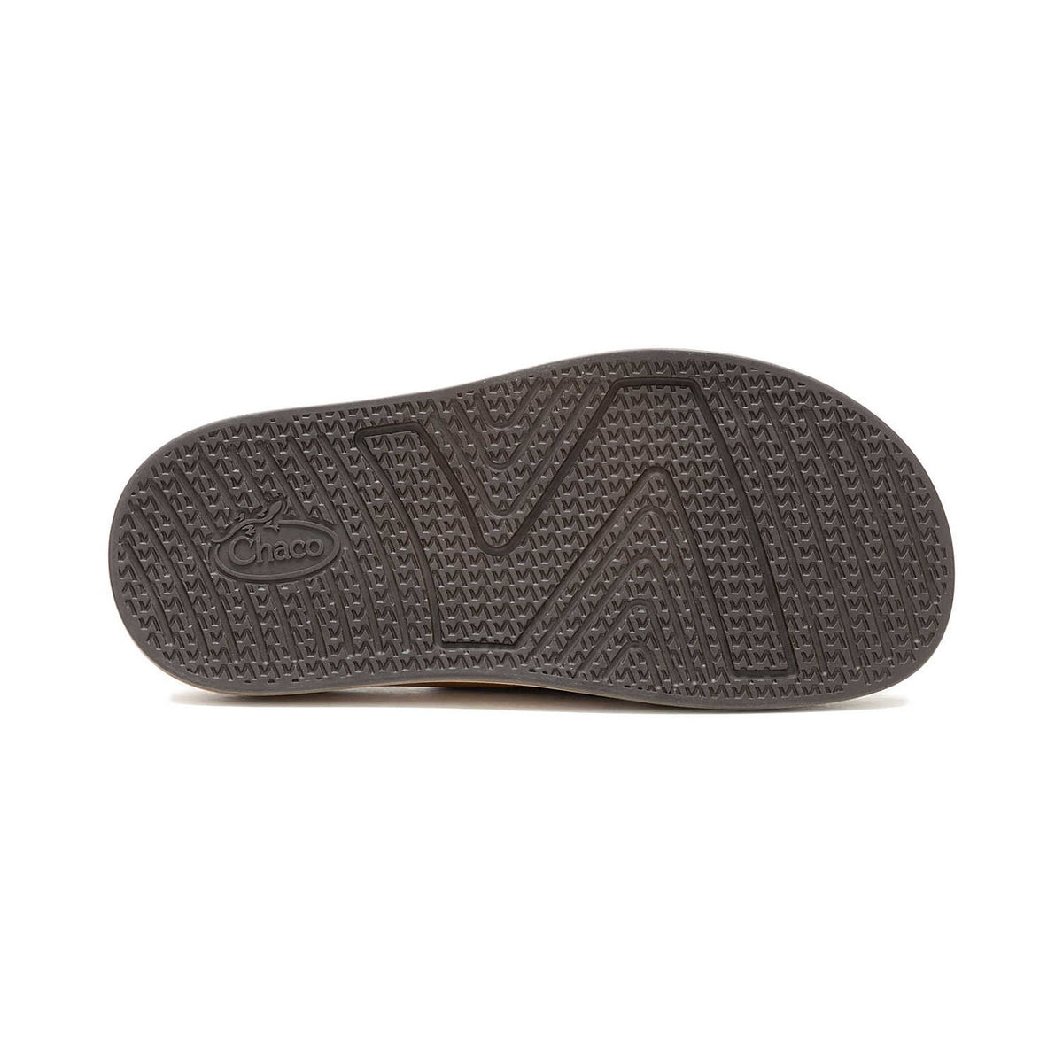 A close-up view of the textured sole of a Chaco townes slide cashew shoe with LUVSEAT footbed, displaying a distinctive zigzag tread pattern.