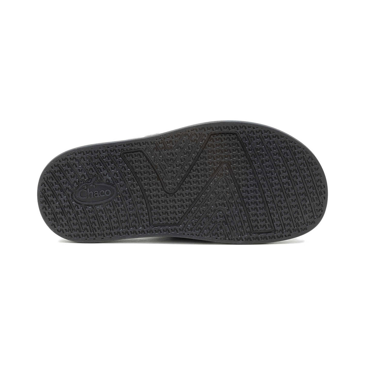 Bottom view of a Chaco Townes Slide Black - Womens sandal sole displaying intricate tread patterns and the Chaco logo on its LUVSEAT footbed.