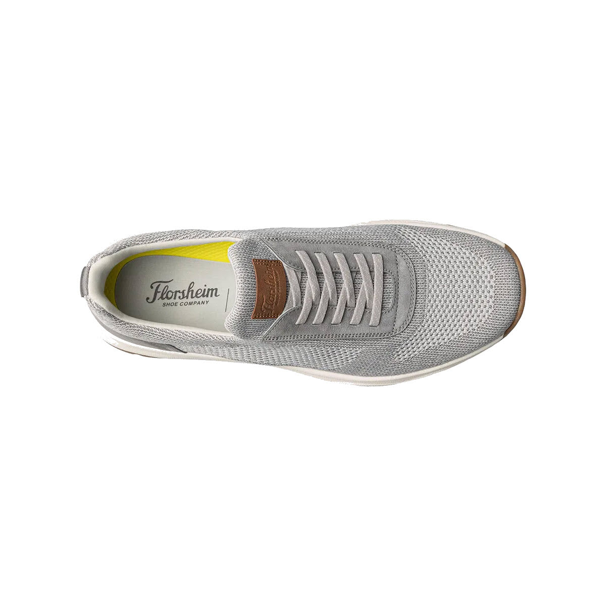 Top view of a gray Florsheim Satellite Knit Elastic Slip On Sneaker with white laces on a white background.