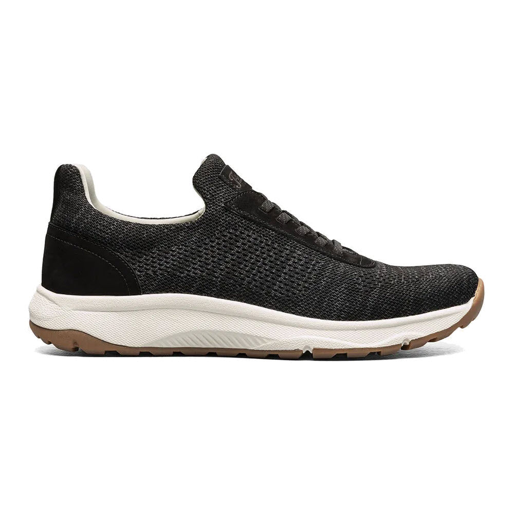 Side view of a Florsheim Satellite Knit Elastic Lace Slip On Sneaker Black - Mens with a textured upper and thick, cushioned Comfortech footbed.