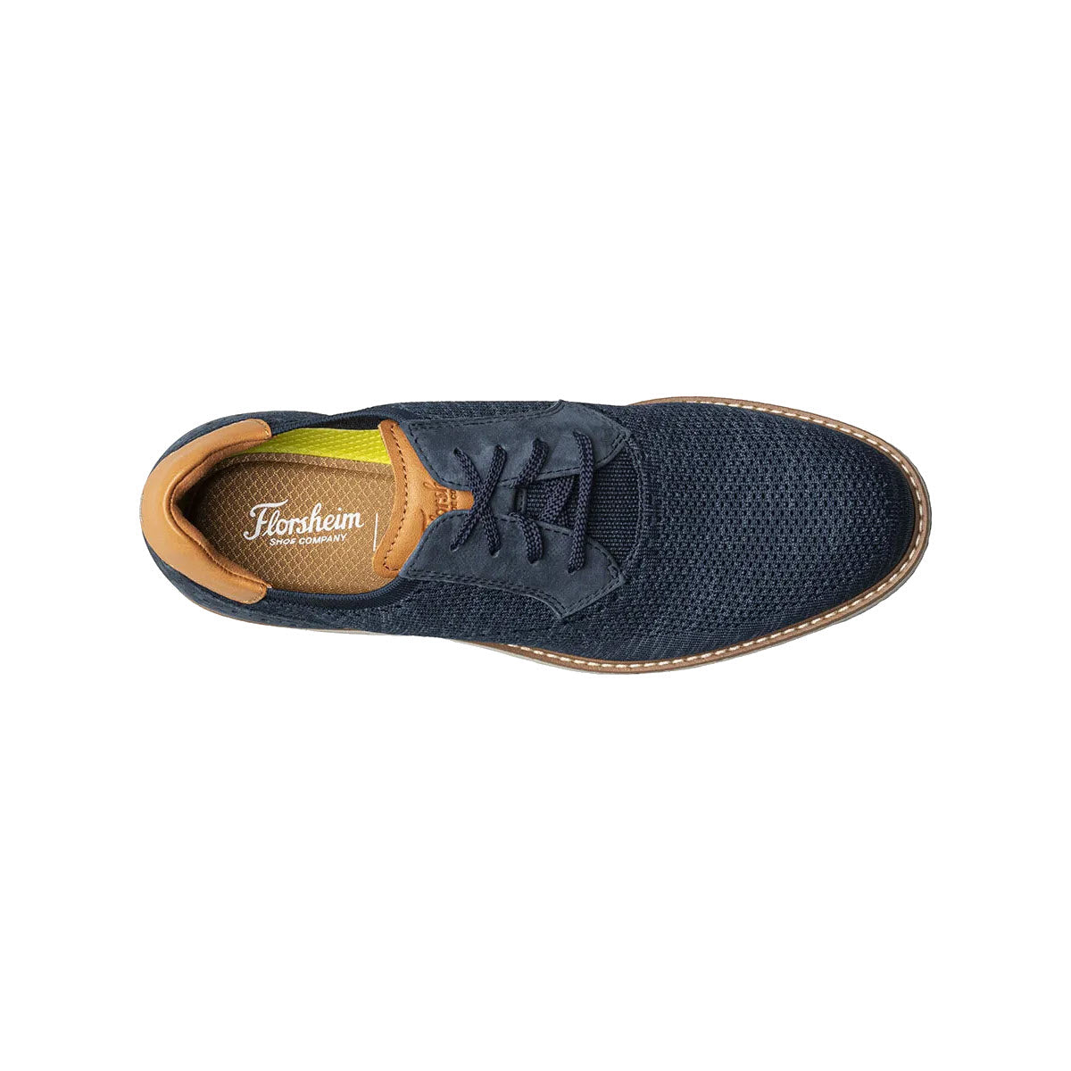 Top view of a dark blue Florsheim Vibe Knit Plain Toe Oxford Navy men&#39;s dress shoe with tan interior and laced up front featuring a Comfortech footbed.