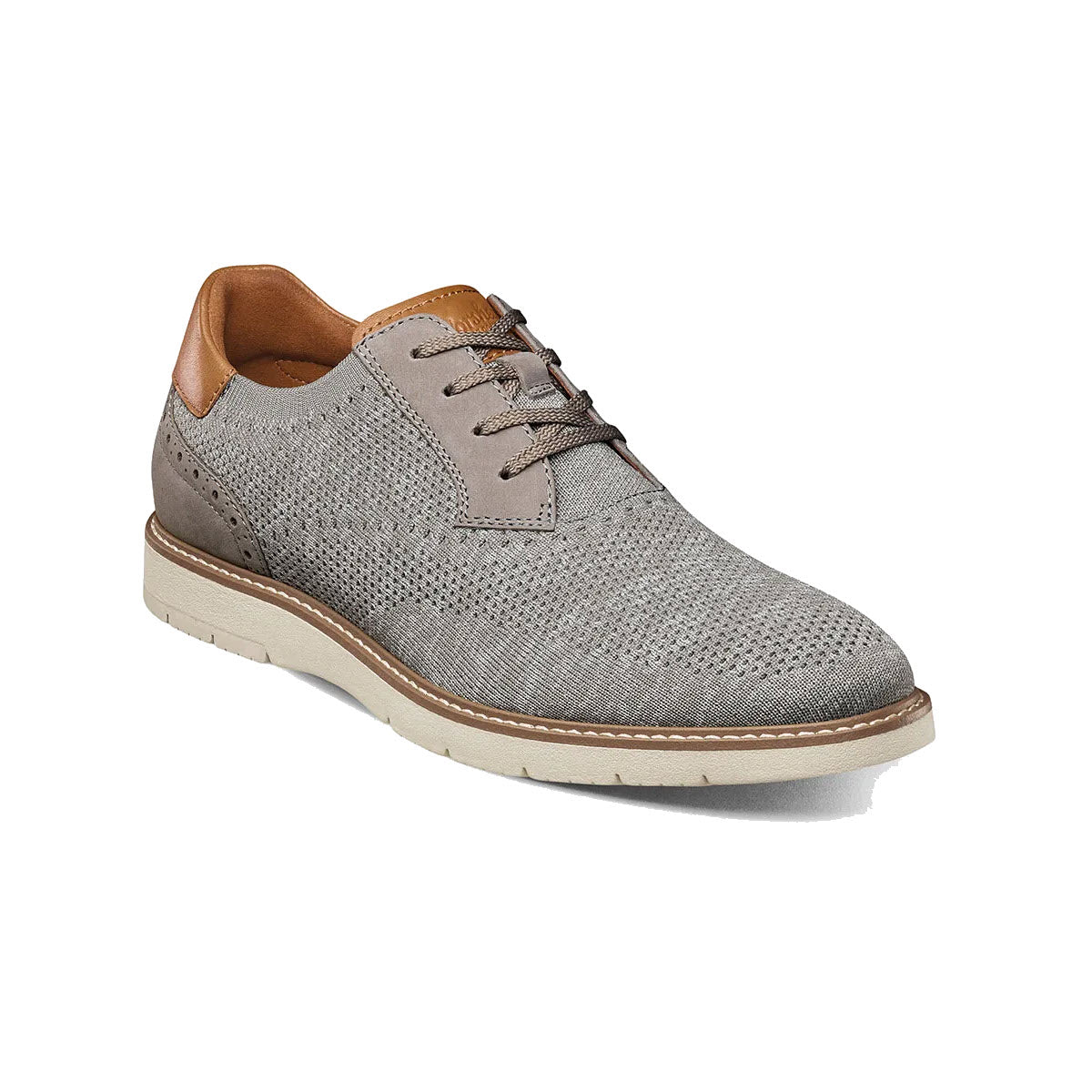 A single Florsheim Vibe Knit Plain Toe Oxford Gray men&#39;s shoe with perforated upper, tan leather accents, and a contrasting white sole.