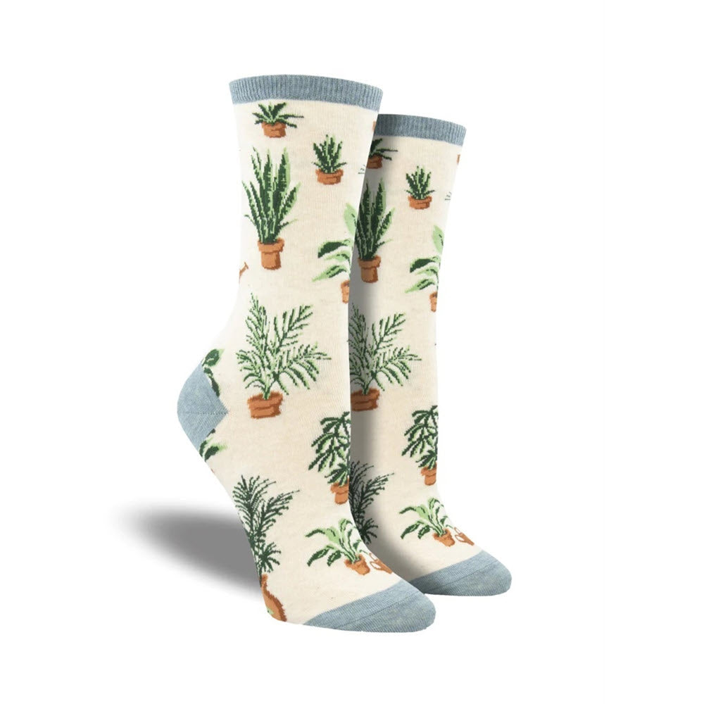 A pair of SOCKSMITH HOMEGROWN CREW SOCKS IVORY featuring various potted plants, designed for women's shoe size, displayed standing against a white background.