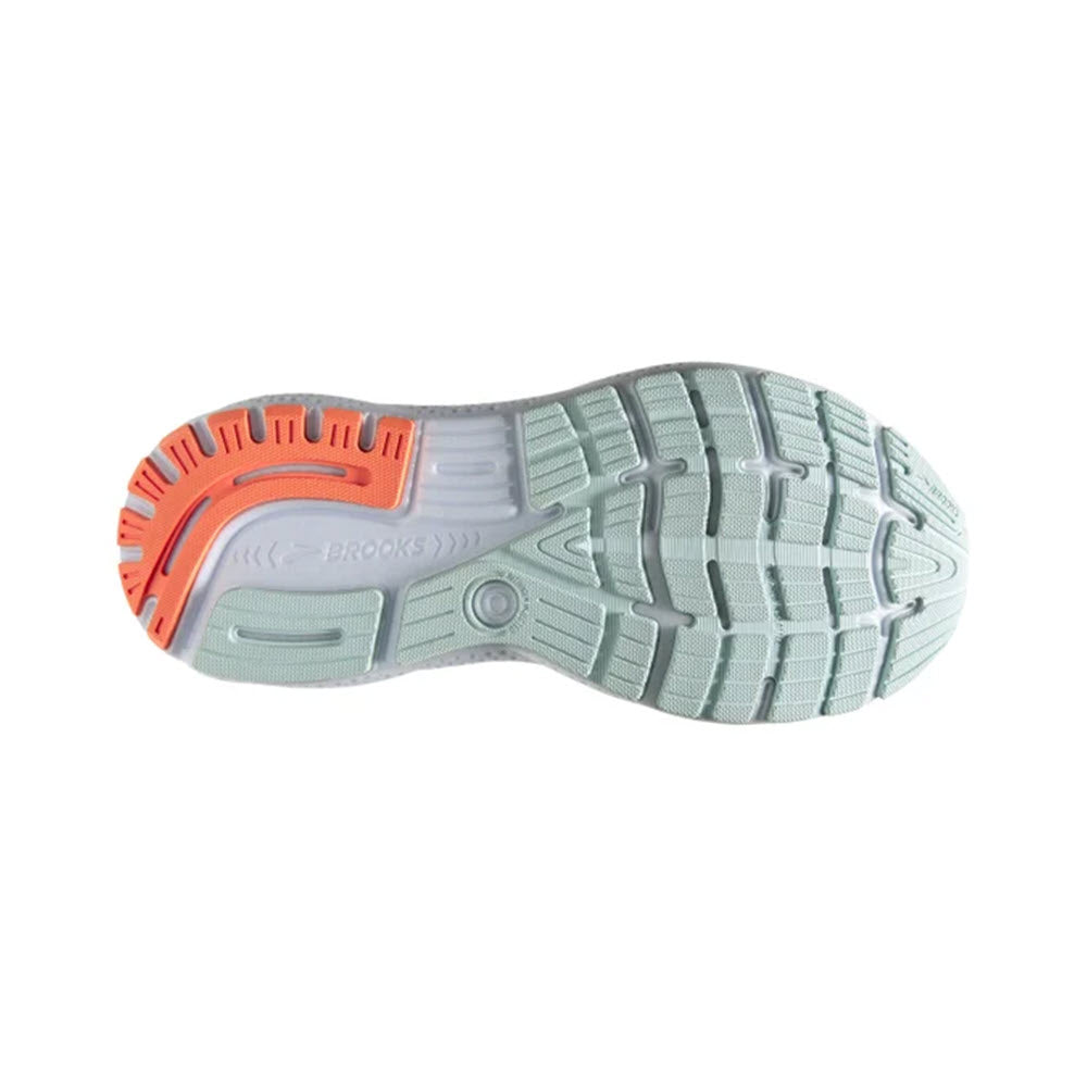 Bottom view of a well-cushioned Brooks Ghost 16 running shoe sole featuring a light green and orange tread design.
