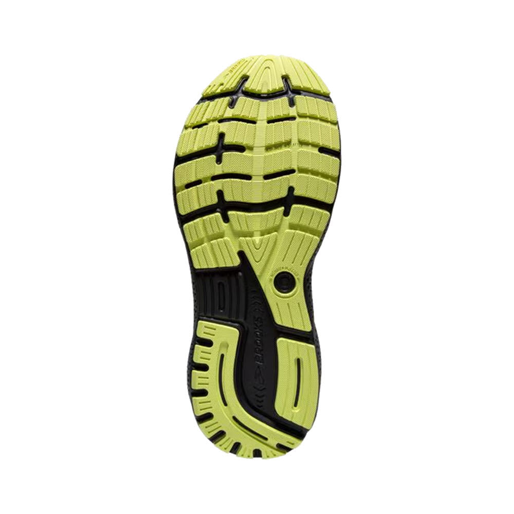 Sole of a men&#39;s Brooks Ghost 16 sport shoe with neon yellow and black tread pattern, highlighting durable and intricate design for grip.