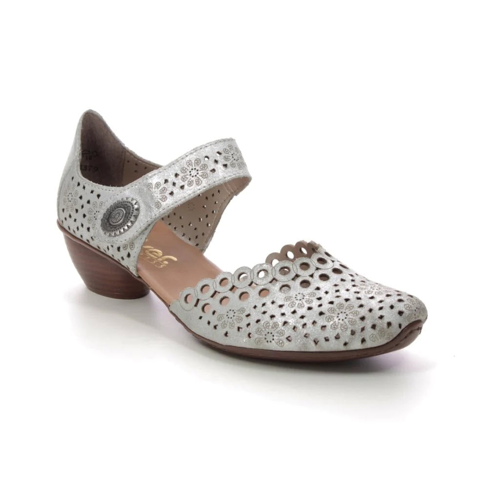 A Rieker silver women&#39;s shoe with a laser-cut design and a small heel, displayed on a white background.