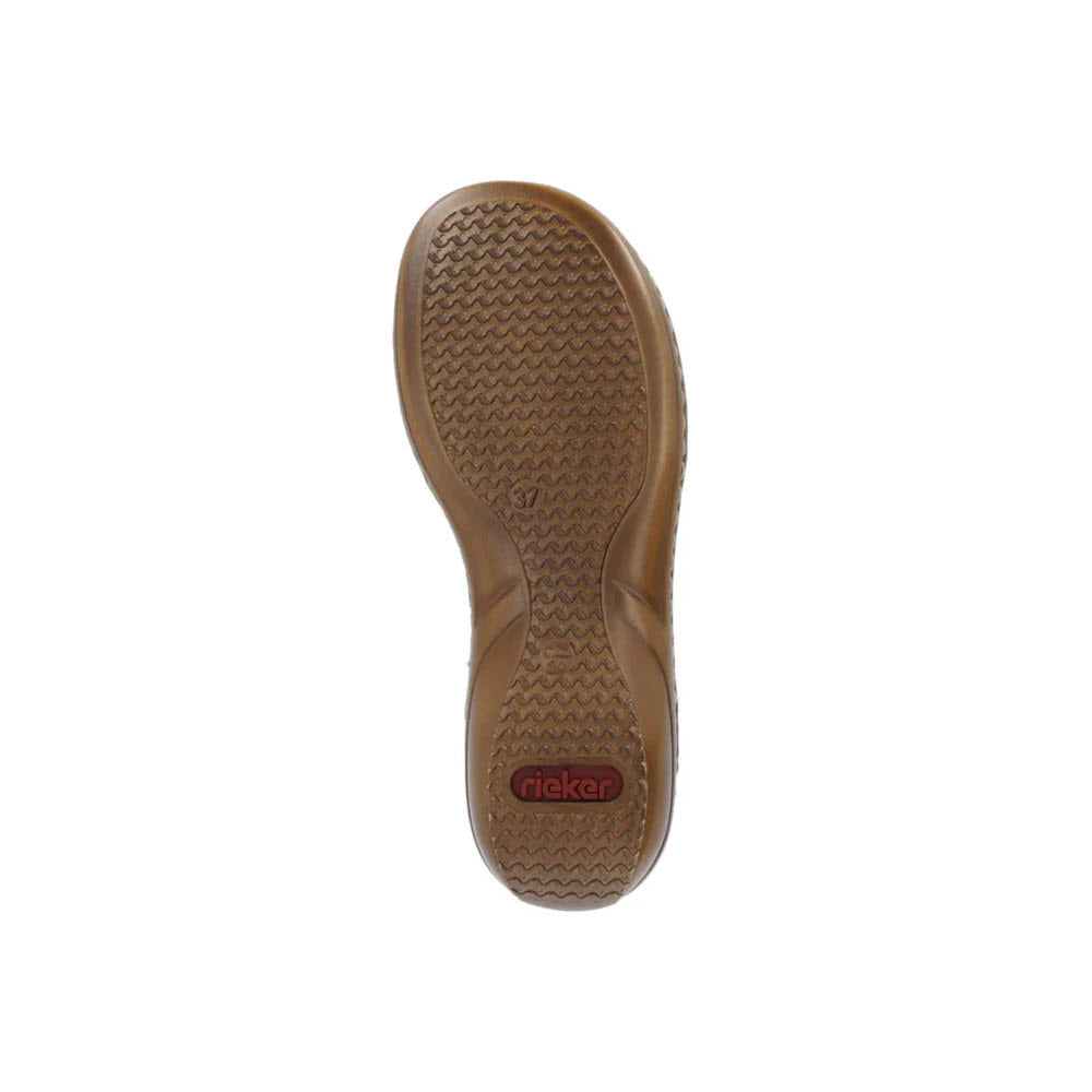 Bottom view of a brown Rieker Slingback Flat with Ornament Mustard shoe sole with a wavy tread pattern and a visible Rieker brand logo, offering perfect fit and versatile styling possibilities.