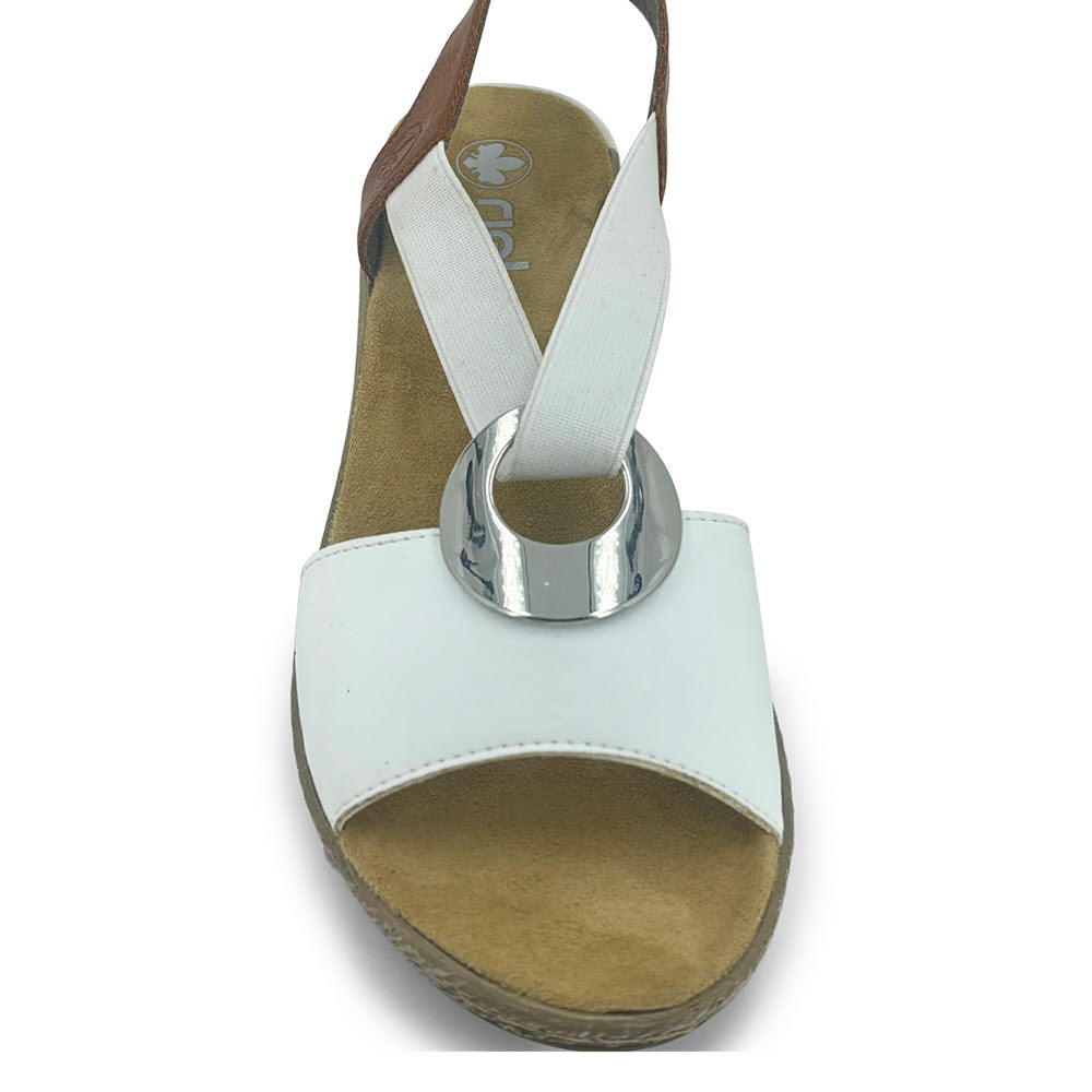 White Rieker women&#39;s thong sandal with a silver loop detail on a white background, crafted from soft leather.