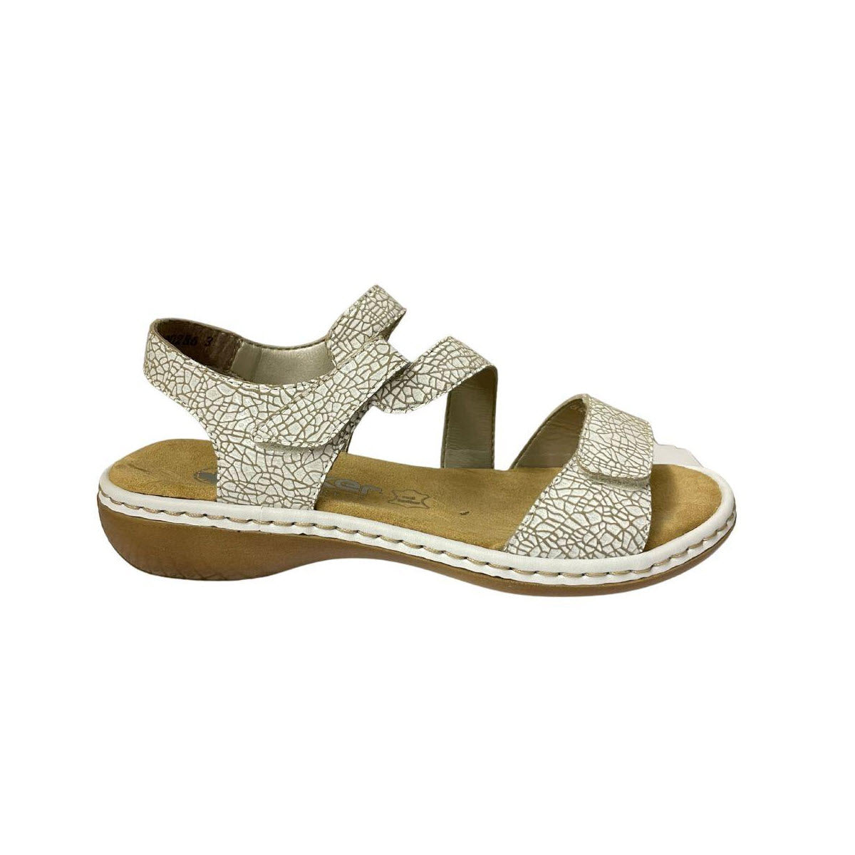 Leather sandals featuring a gold crackle pattern with double straps and hook-and-loop adjustability, set on a cork sole, isolated on a white background - RIEKER COMFORT Z STRAP WHITE CRACKLE WOMENS by Rieker