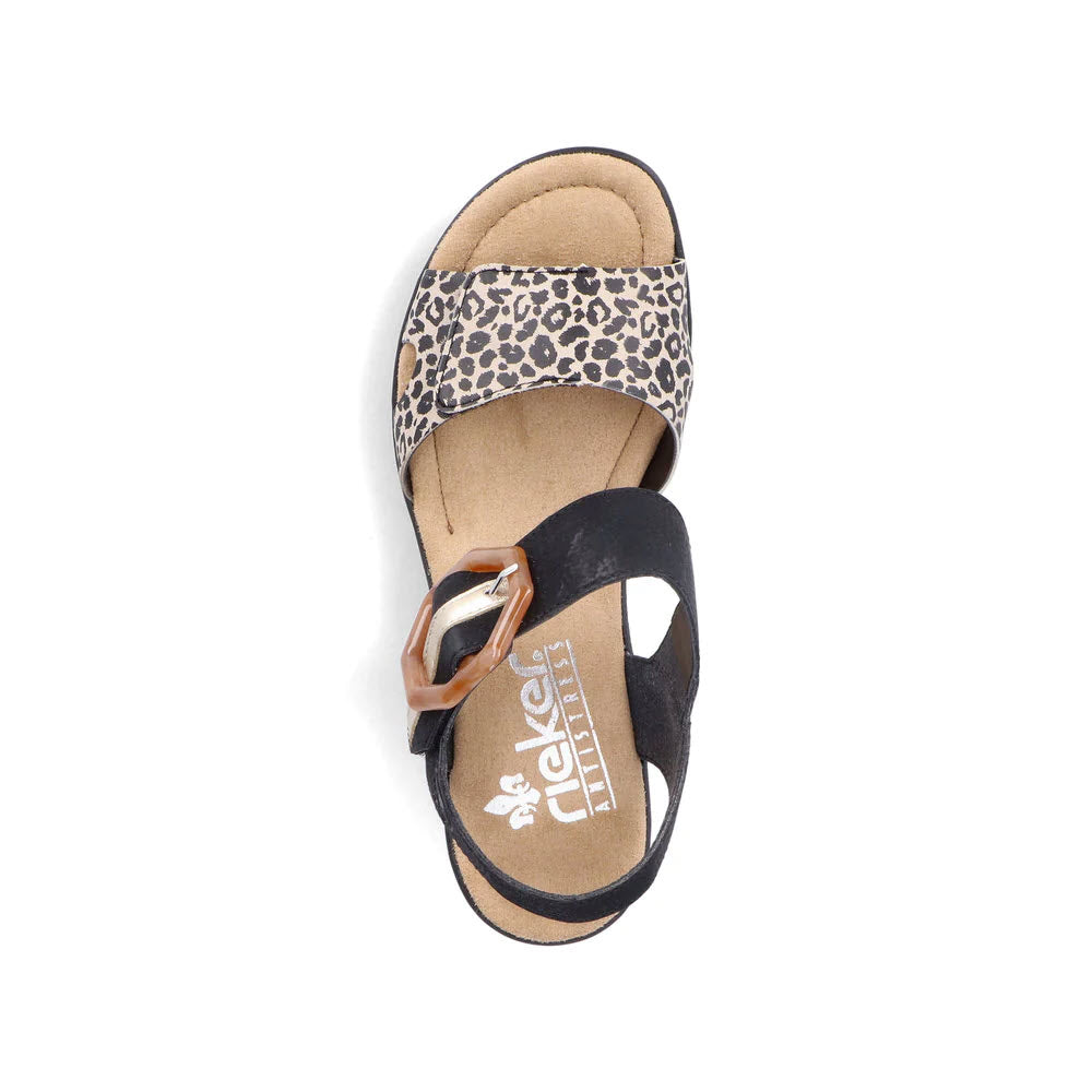 Top view of Rieker ladies&#39; sandals with leopard print design, featuring a toe loop and a decorative buckle.