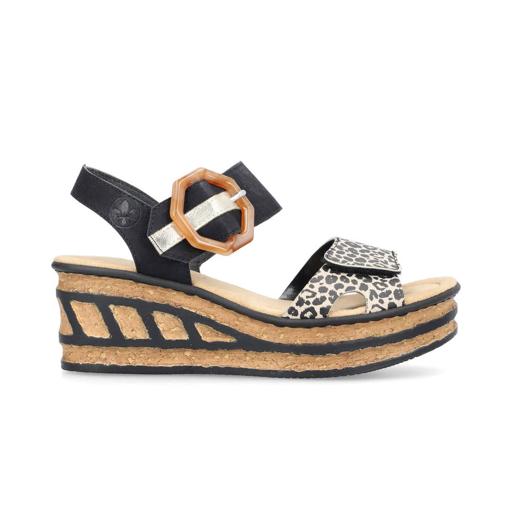 Rieker leopard multi patterned ladies&#39; sandals with a cork wedge, ornamental buckle, and ankle strap on a white background.
