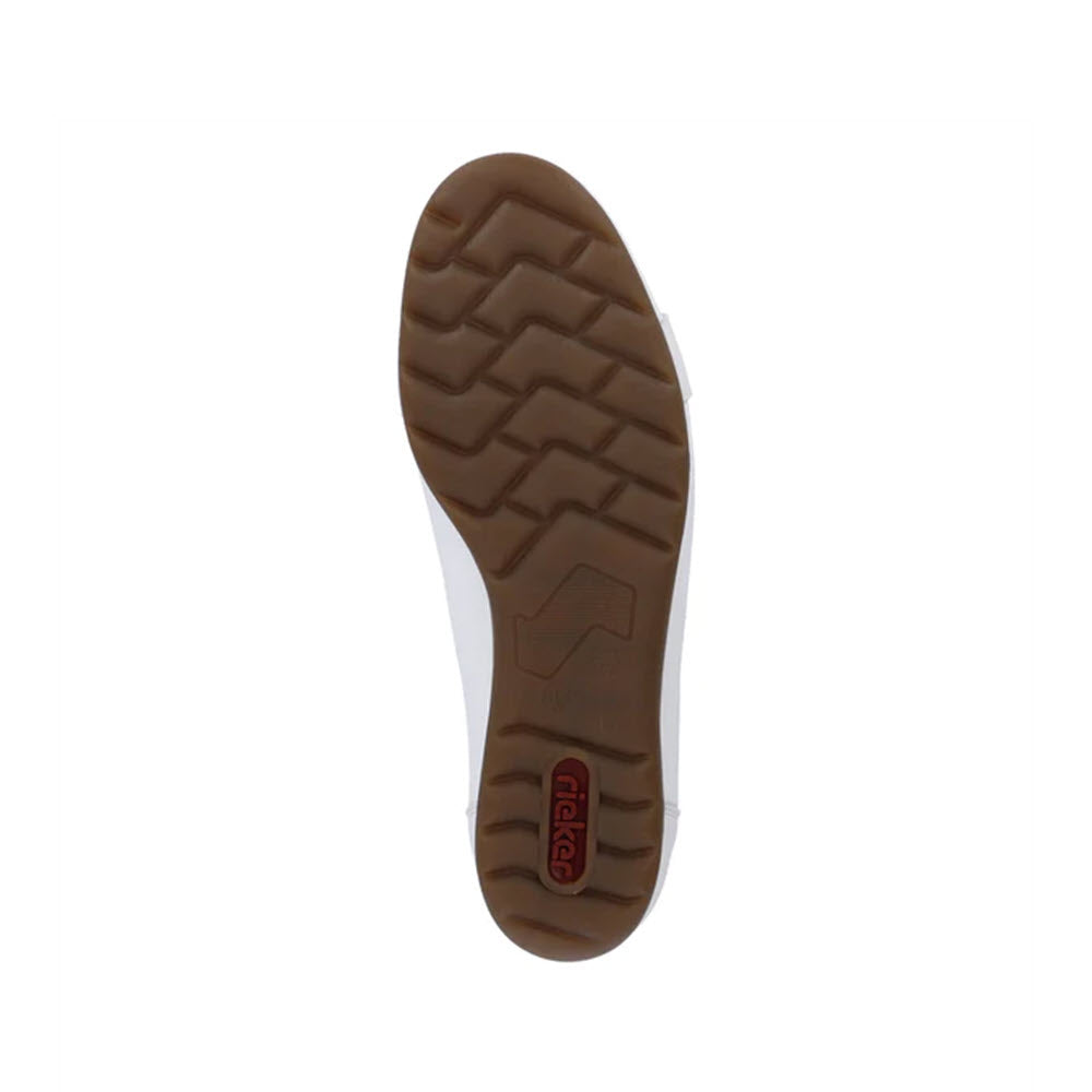 Bottom view of a Rieker shoe showing a brown rubber sole with a zigzag pattern and a Rieker slip-on shoe logo.