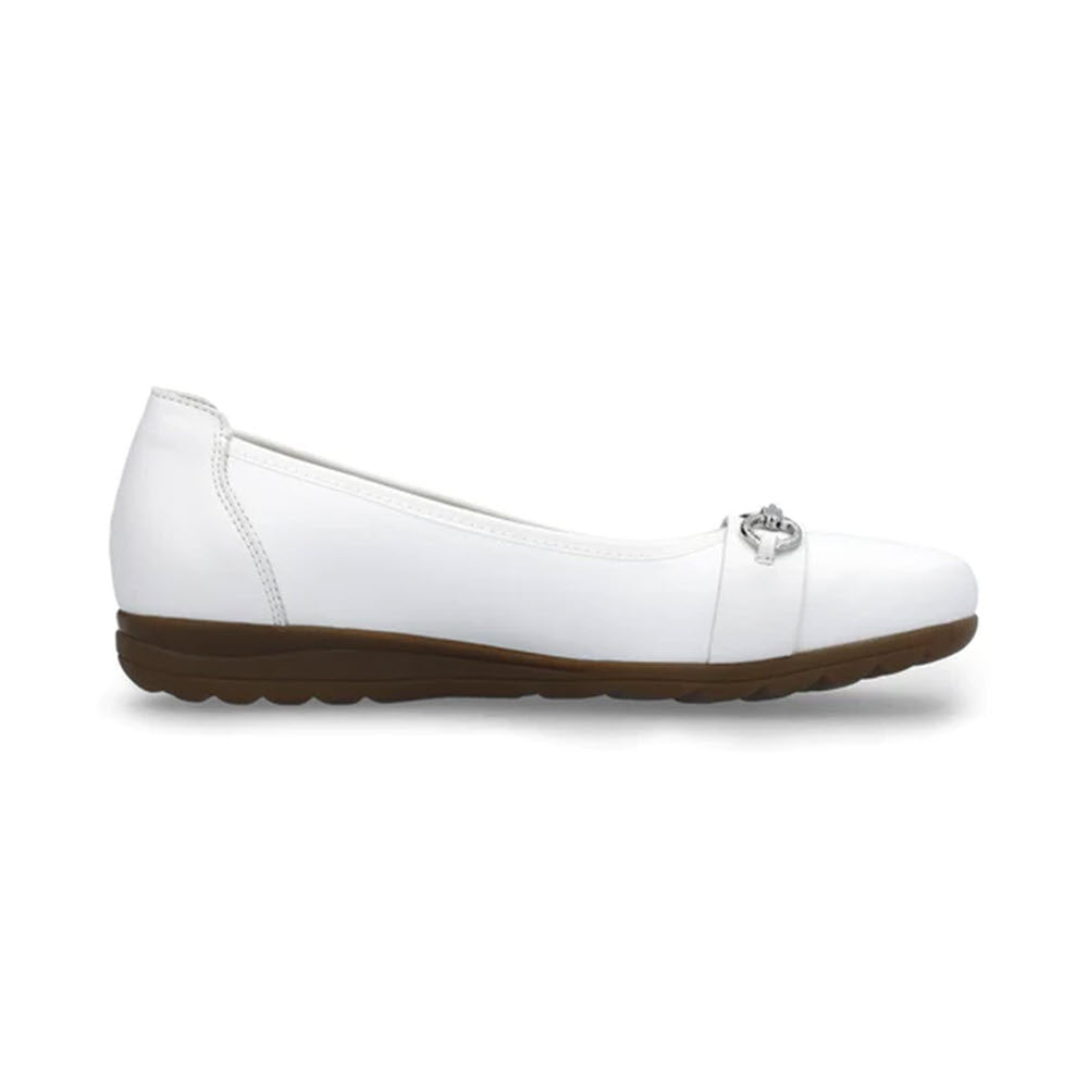 Rieker white leather ballet flat with a decorative metal clasp on the toe and a brown rubber sole, isolated on a white background.