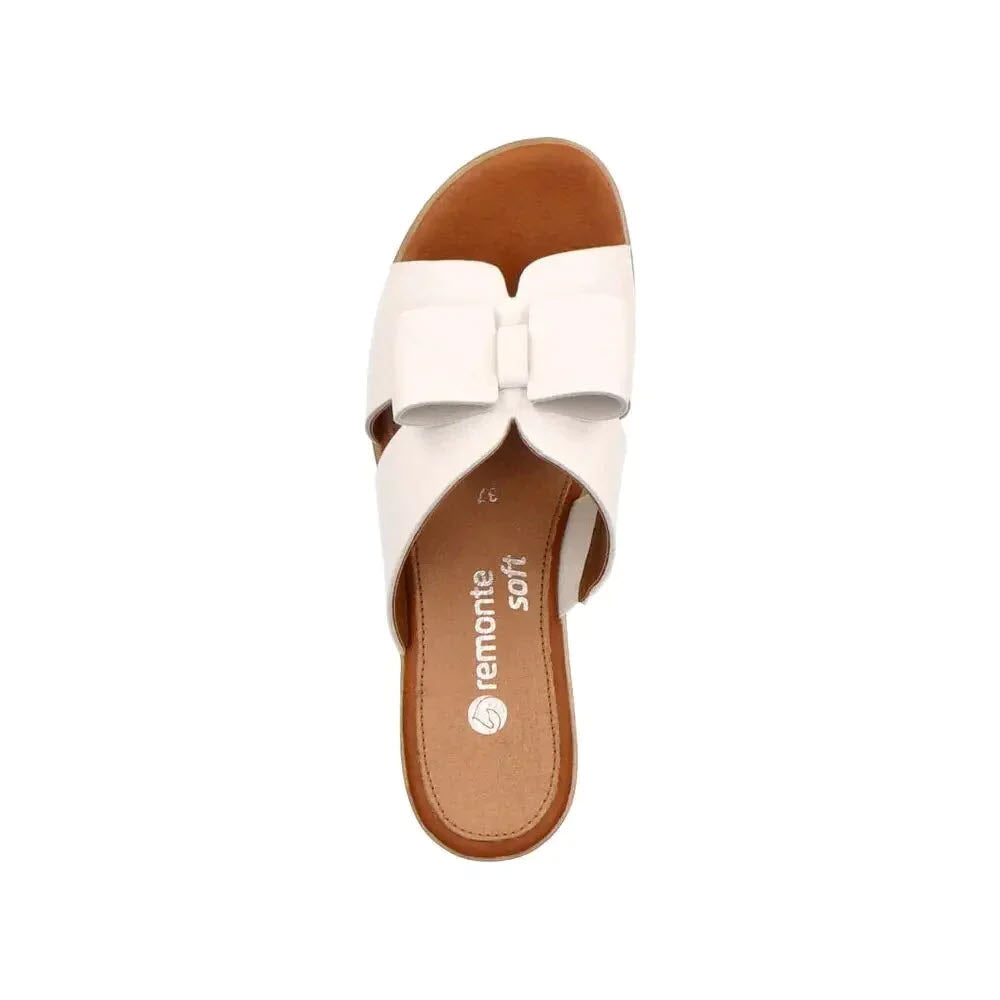 Top view of a white REMONTE BOW WEDGE SANDAL with a bow accent on the strap, displaying the branding &quot;Remonte&quot; on the cushioning sole.