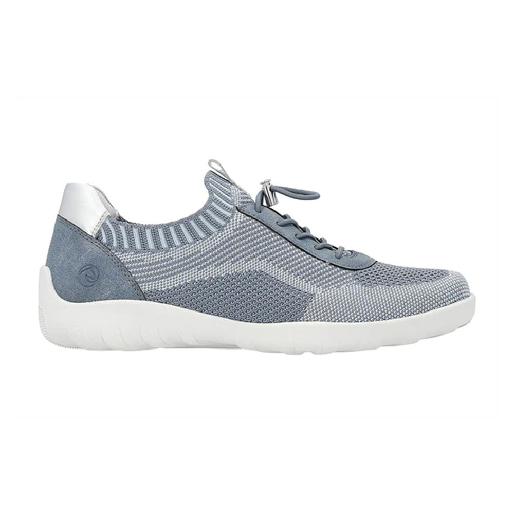 A side view of a blue-grey athletic walking shoe with white accents and a white sole, featuring a knit upper and lace-up closure, ideal for those seeking comfort and style in a women&#39;s sneaker, the REMONTE LITE &amp; SOFT SNEAKER DENIM - WOMENS by Remonte.