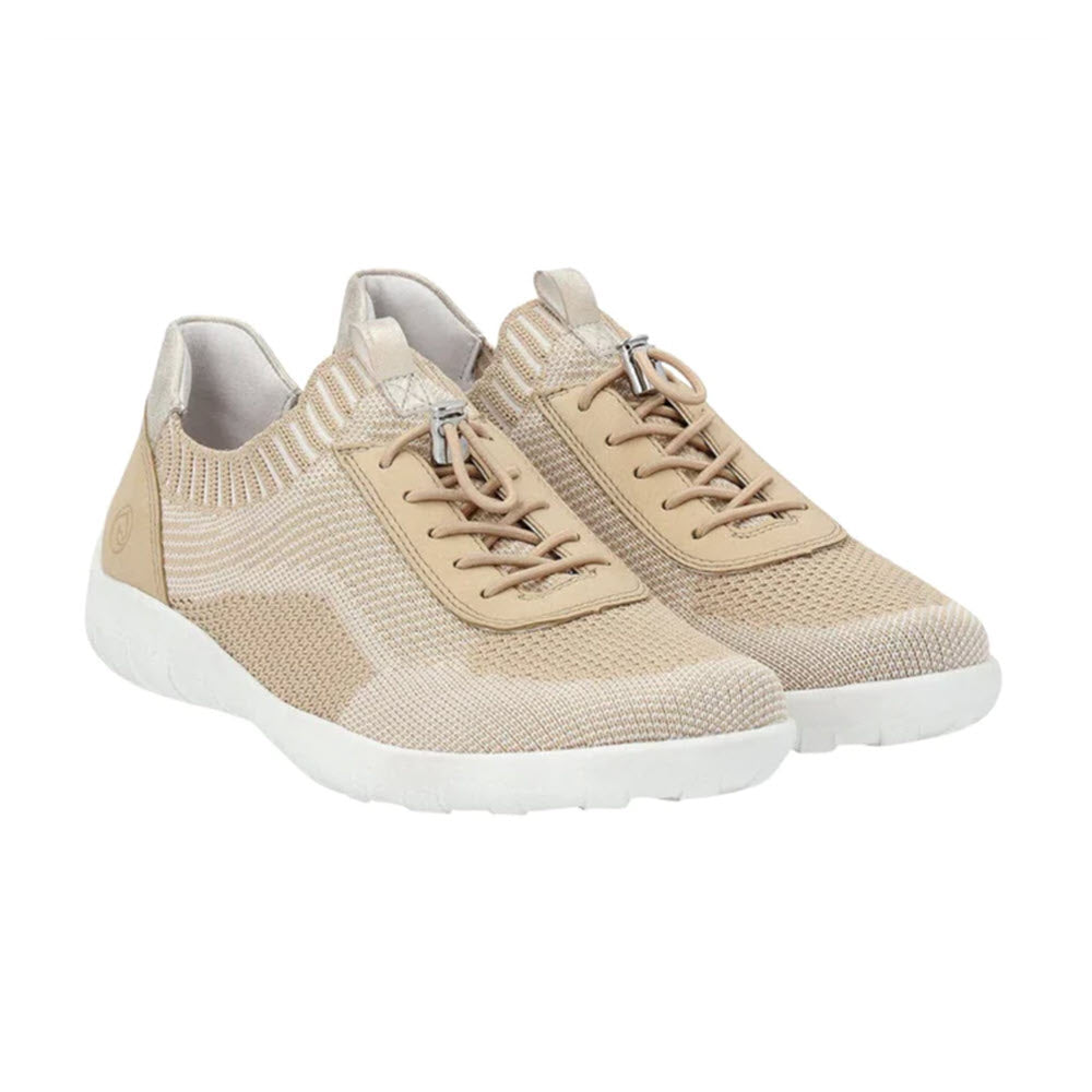 A pair of beige athletic shoes with white soles and tan laces, enhanced with an elastic band for a snug fit, displayed against a white background. The product is the REMONTE LITE &amp; SOFT SNEAKER VANILLA - WOMENS by Remonte.