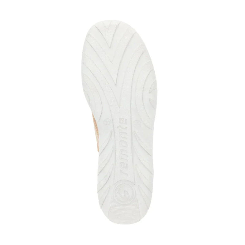 The image shows the textured sole of a Remonte REMONTE LITE &amp; SOFT SNEAKER VANILLA - WOMENS, featuring a white color and intricate groove patterns for traction. The Lite &#39;n Soft design provides comfort similar to that of Remonte slippers, ensuring every step is cushioned.