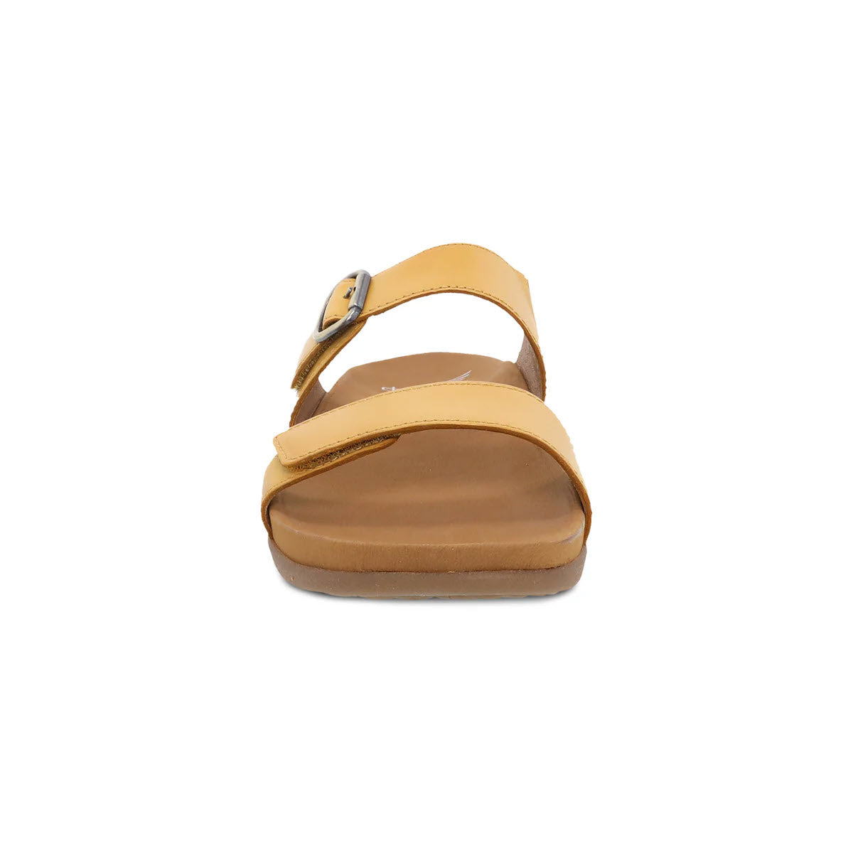 A single Dansko tan slide sandal with a thick strap over the toes and a thinner ankle strap, displayed against a white background.