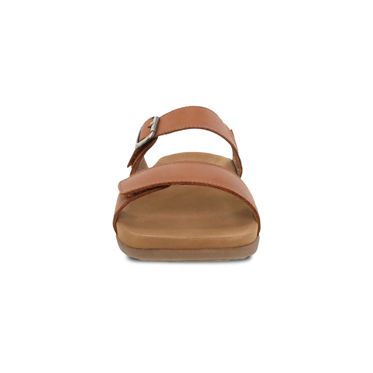 A single brown leather Dansko Justine Luggage slide sandal with a strap around the big toe and adjustable ankle buckle, viewed from the front against a white background.
