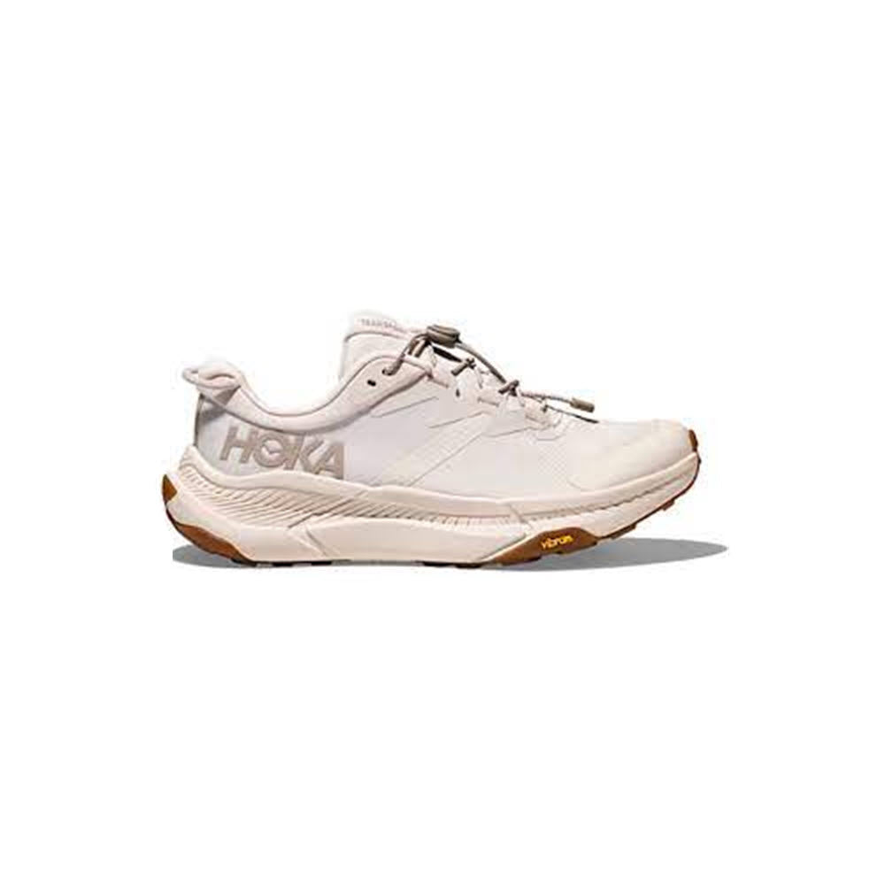 A single Hoka Transport Eggnog/Eggnog - Womens running shoe in white, featuring a Vibram® EcoStep Natural outsole, displayed on a neutral background.