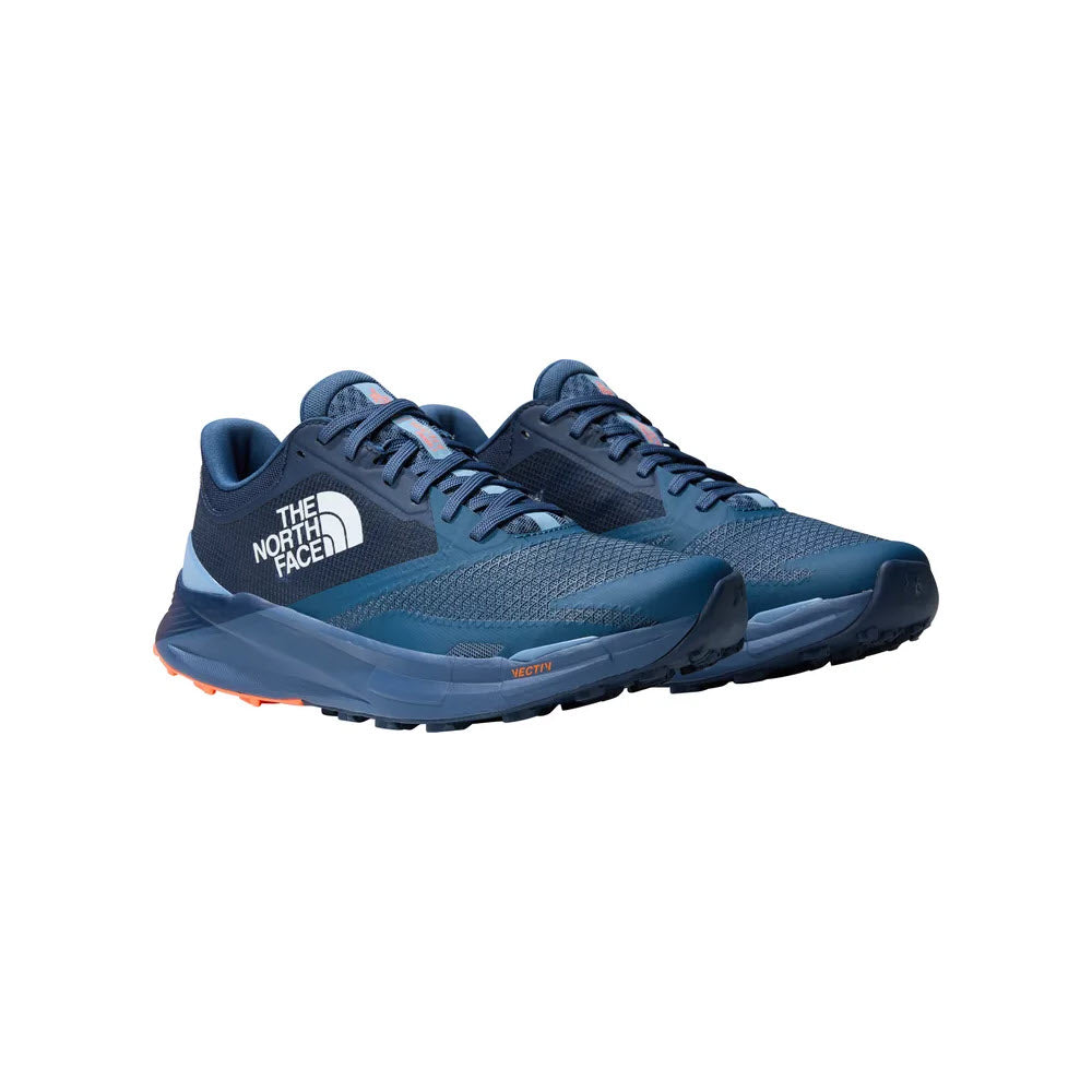 A pair of blue NORTH FACE VECTIV ENDURIS 3 SHADY BLUE/SUMMIT NAVY trail running shoes featuring VECTIV technology, with prominent logos and rugged soles.