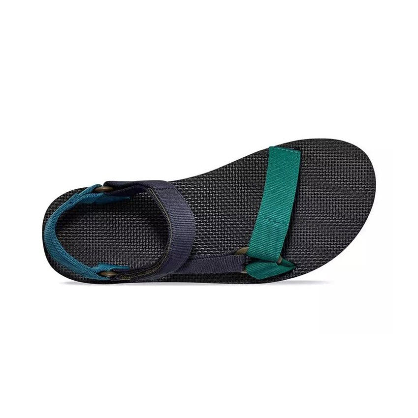 A single navy blue Teva Original Universal sandal with green straps, displayed against a white background.