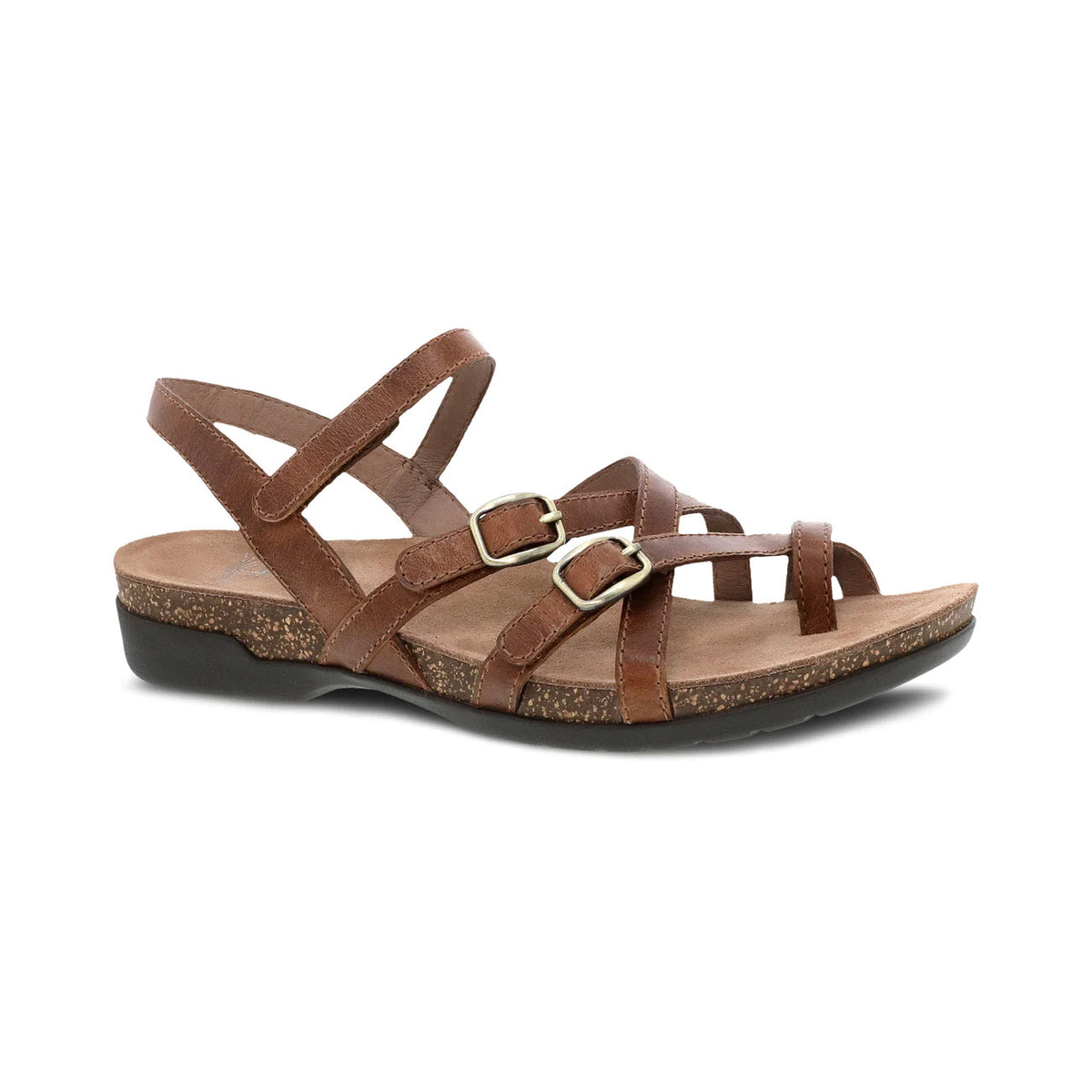 A Dansko Roslyn Tan strappy sandal with a buckle and a low heel, isolated on a white background.