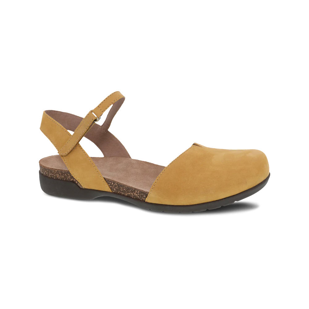 A single mustard leather summer sandal with a strap over the ankle and a closed toe on a white background.