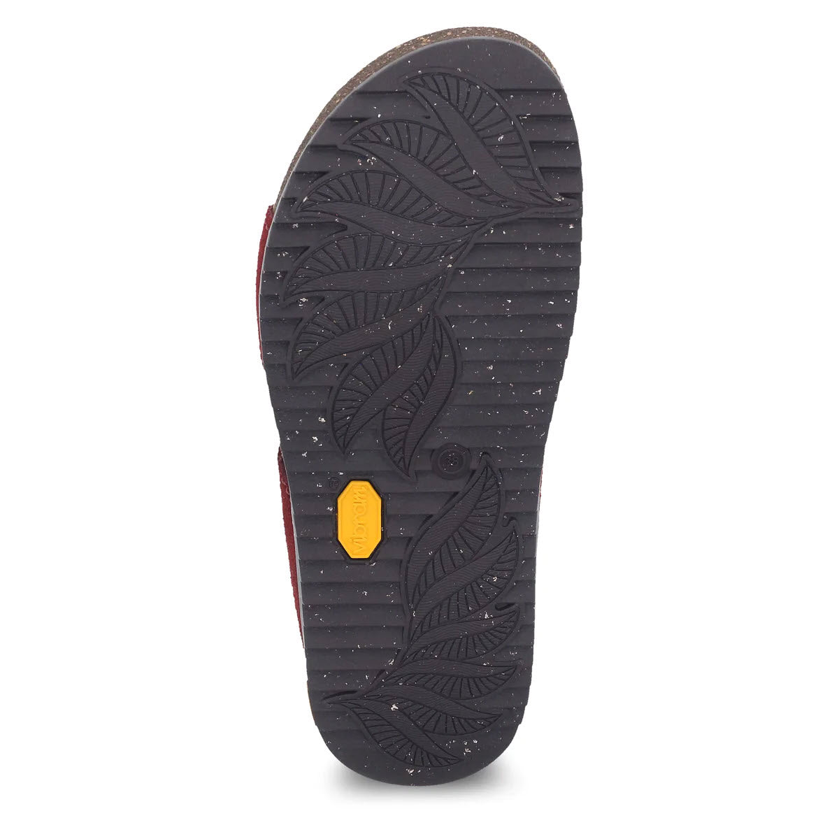 Sole of a shoe with textured leaf pattern and a small yellow rectangular logo on a Dansko ECOSTEP EVO rubber outsole.