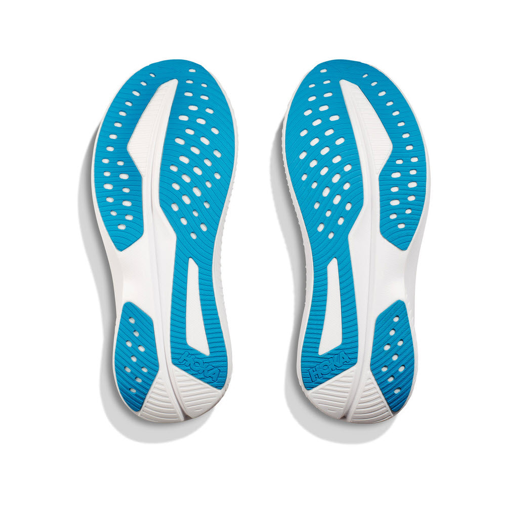 A pair of Hoka Mach 6 White/Nimbus Cloud - Womens sports shoe soles with super critical foam, isolated on a white background.