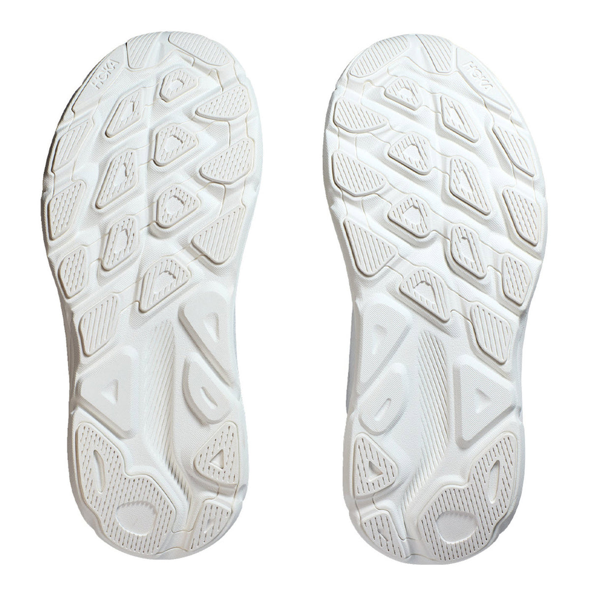 Pair of HOKA Clifton 9 rubber soles against a white background.