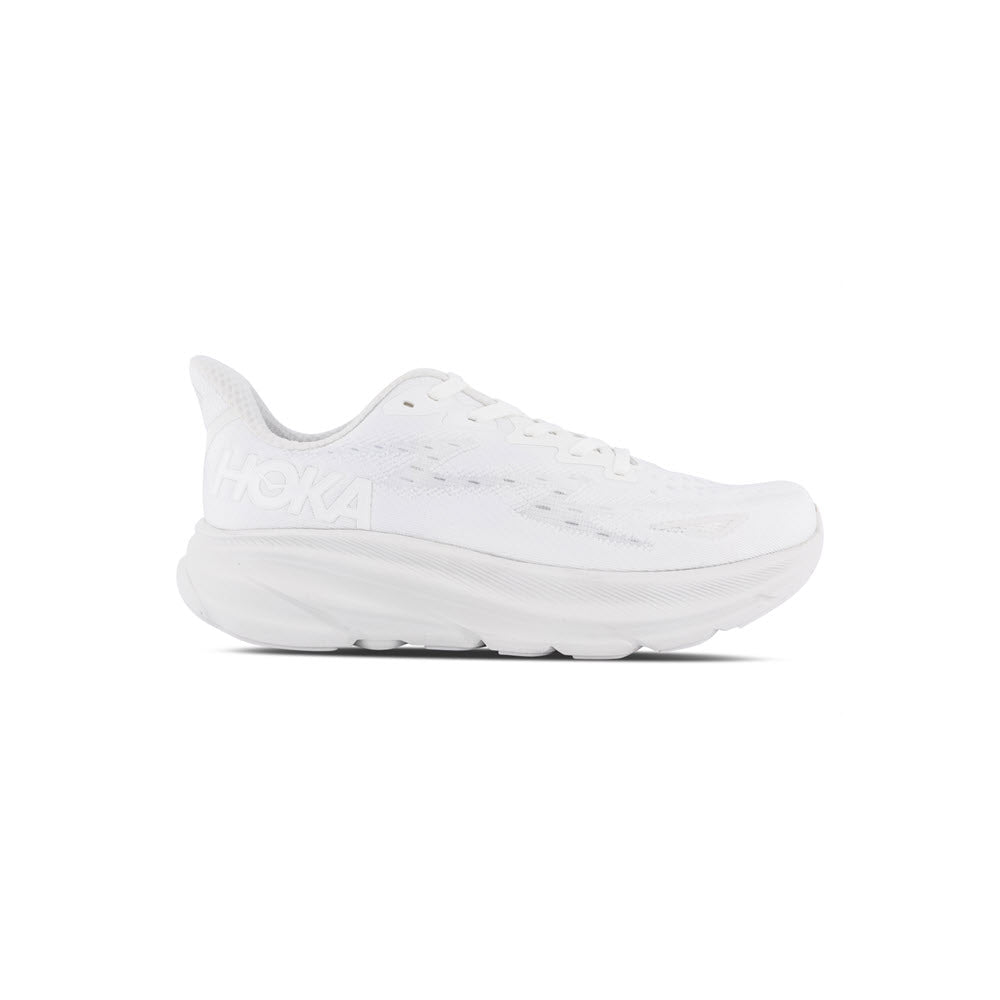 A white Hoka Clifton 9 running shoe displayed against a white background, featuring an improved outsole design.