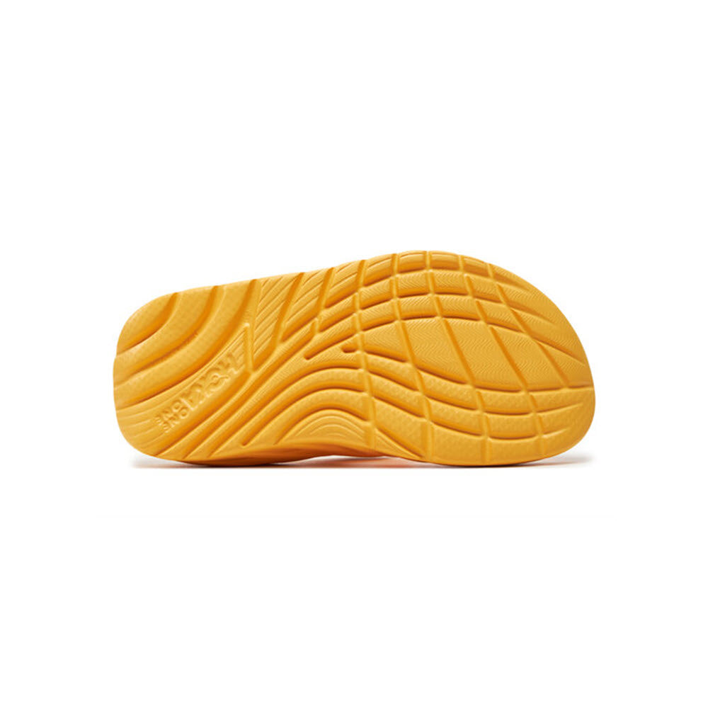 Hoka Orange shoe sole with Meta-Rocker geometry, featuring grooves and branding, isolated on a white background.