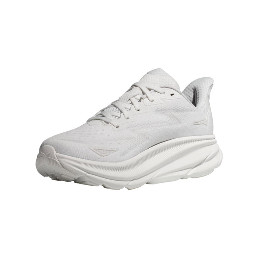 A single white Hoka Clifton 9 running shoe isolated on a white background, featuring a chunky sole and lace-up design with an improved outsole design.